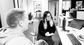 Employees at digital agency Candour discussing work