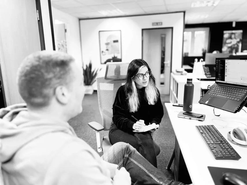 Employees at digital agency Candour discussing work