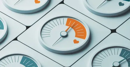 a set of dials with the orange one featuring a heart shining through